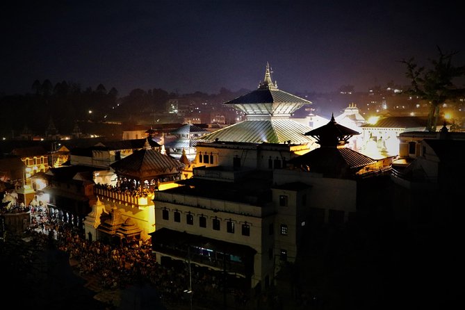 Evening Photography Tour of Kathmandu - Boudhanath: butter lamps around the white dome