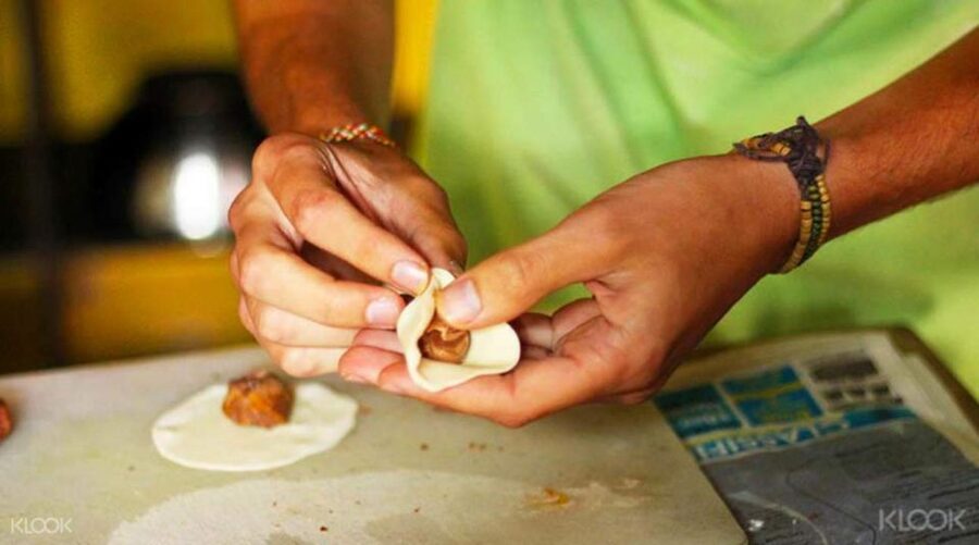 Kathmandu: Nepali Cooking Class with Hotel Pickup - Cooking momo, curry, roti, and sel roti