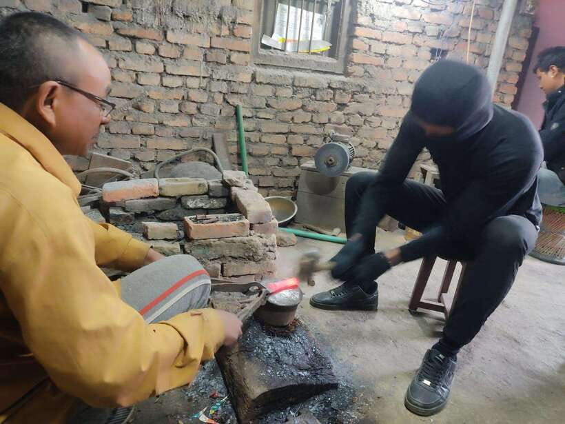 Knife Khukuri Making Workshop - Hammering a raw piece of iron into a blade